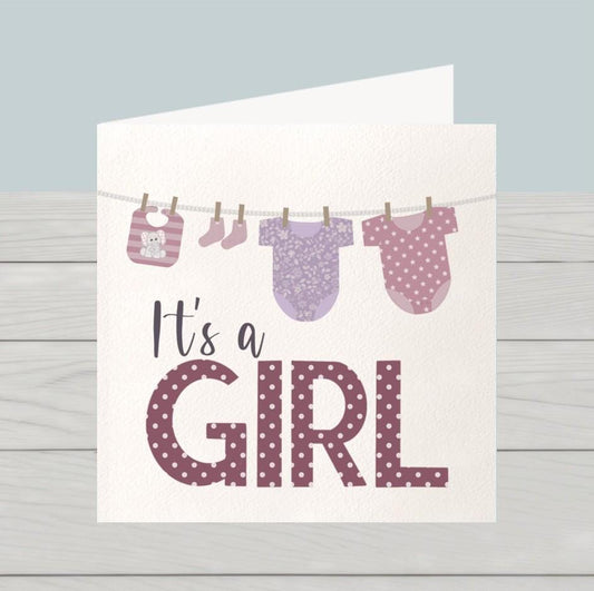 Newborn baby girl card: Congratulations baby girl card, pink baby clothes on washing line