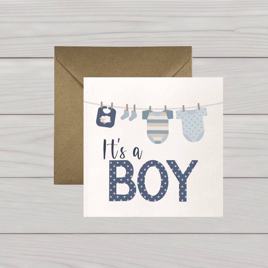 Newborn baby boy card: Congratulations baby boy card, blue baby clothes on washing line