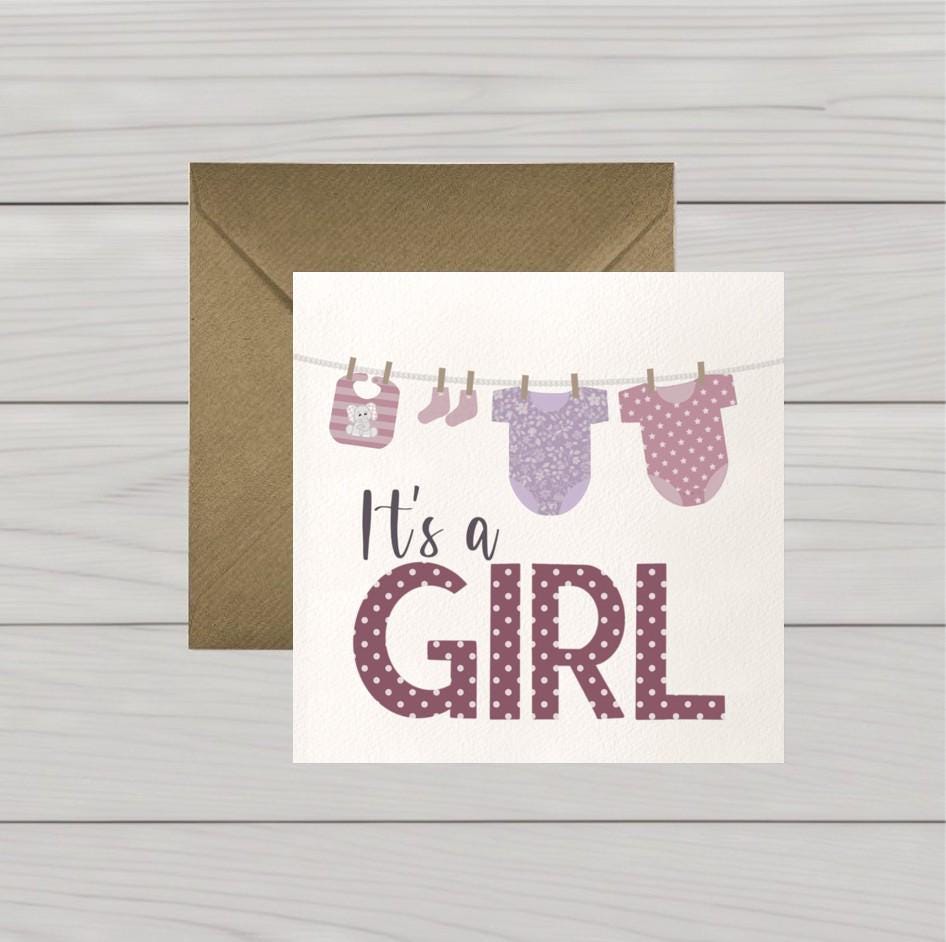 Newborn baby girl card: Congratulations baby girl card, pink baby clothes on washing line