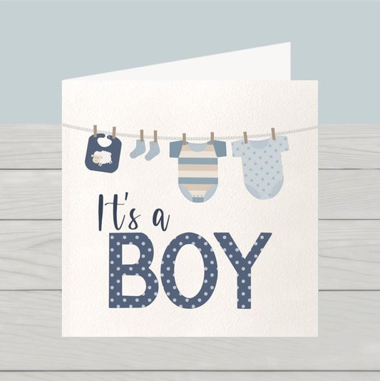 Newborn baby boy card: Congratulations baby boy card, blue baby clothes on washing line